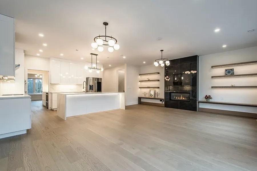 Fleetview Drive — The custom work, photographed before a stick of furniture arrived — a full-height built-in wall, chevron panelling, and a kitchen with its own prep pantry. Designed by MAD Design Interiors in Halifax.