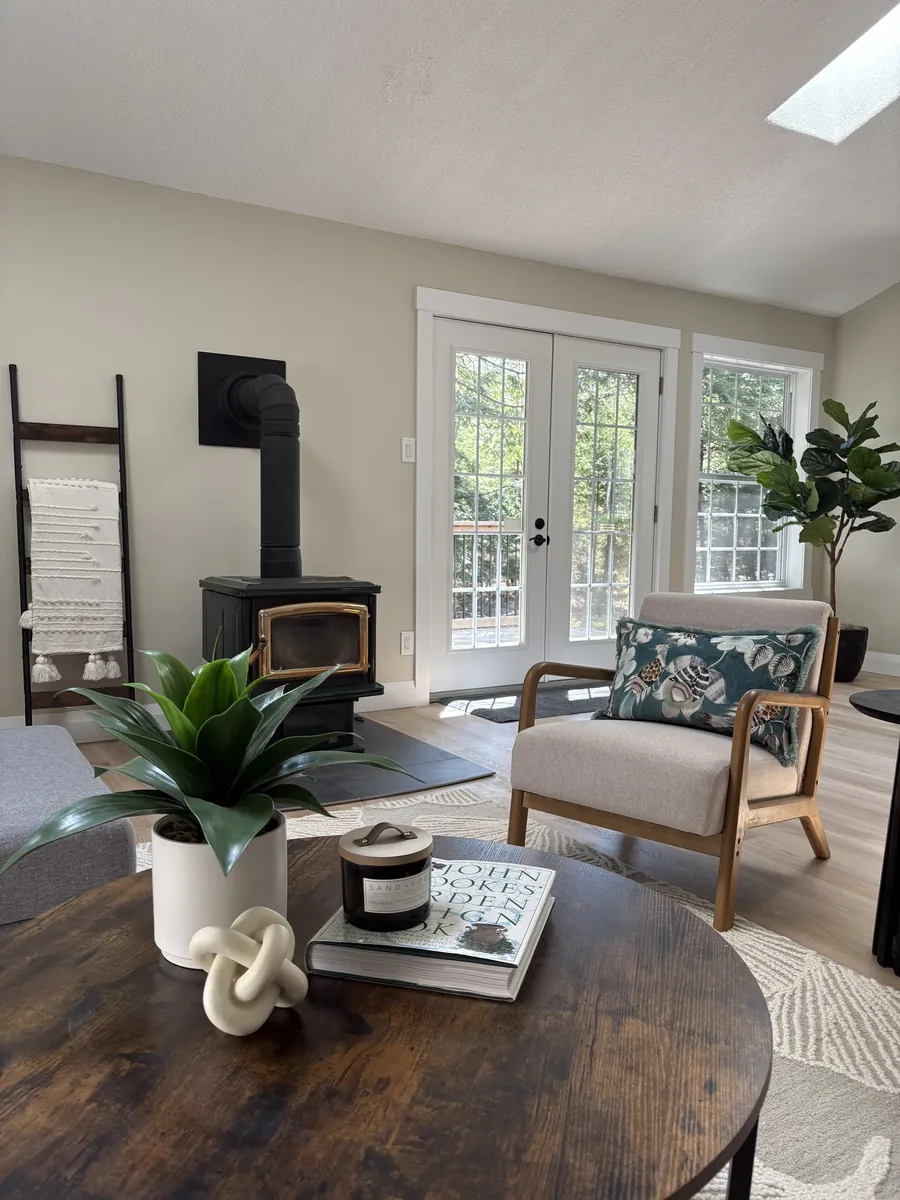 Gail Avenue — A whole-house transformation, photographed from the same spots before and after — kitchen, living, baths and the finished basement. Designed by MAD Design Interiors in Halifax.