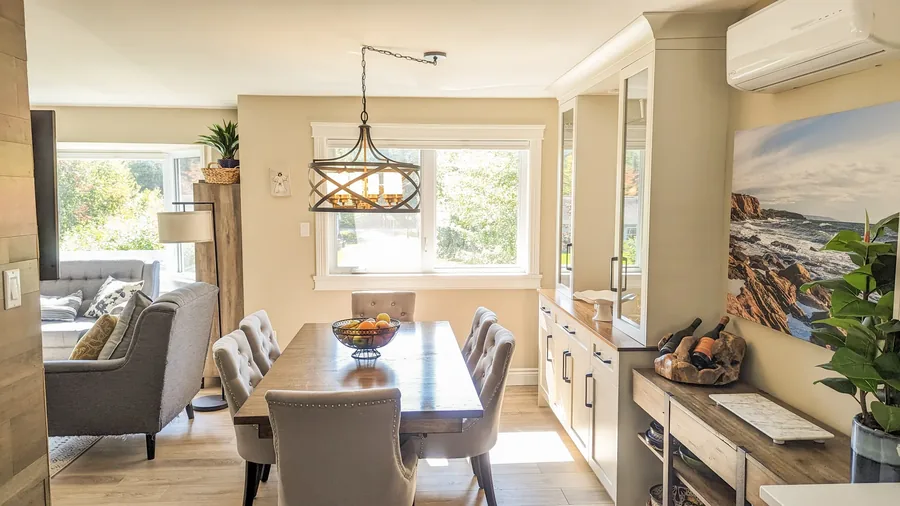 Longards Road — A dated ground floor reworked into one connected space: kitchen, dining, family room and a wet bar where a wall used to be. Designed by MAD Design Interiors in Halifax.