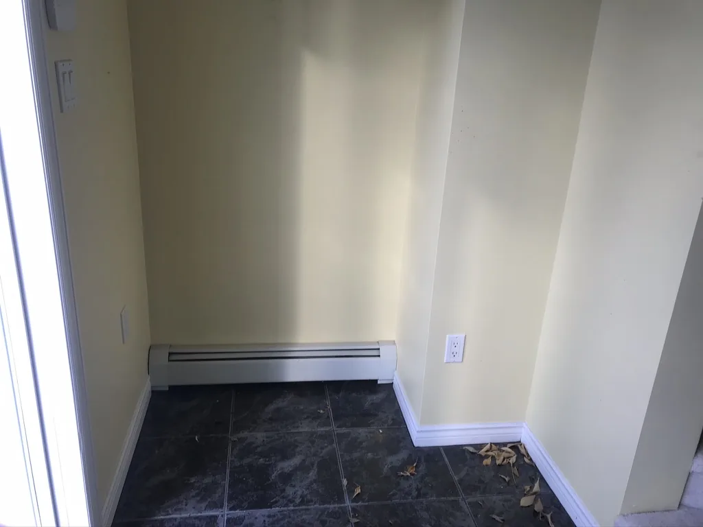 Spinnaker Drive — Foyer, before the renovation by MAD Design Interiors